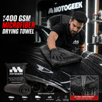Person using a Motogeek microfiber drying towel on a car with product packaging and branding displayed.